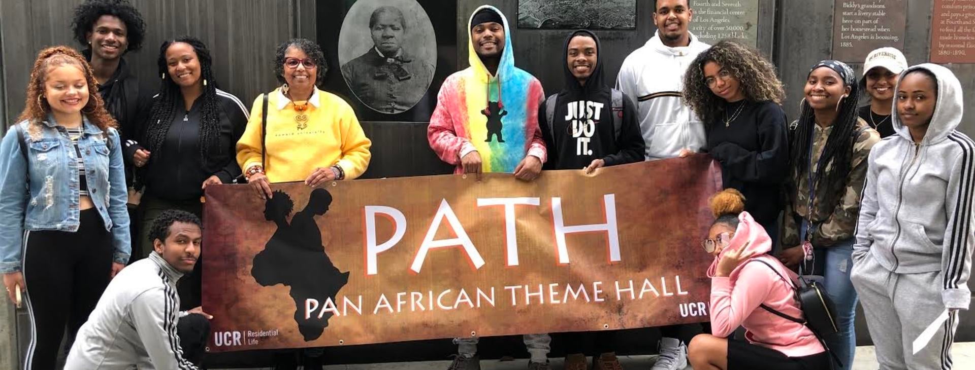 ASP's P.A.T.H. student take a group photo in front of Grandma Mason's memorial in Los Angeles