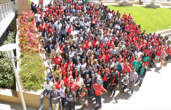 Crowd of UCR ASP community gathered on campus lawn.